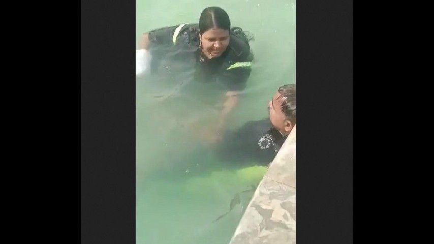 Giving handjob in swimming pool