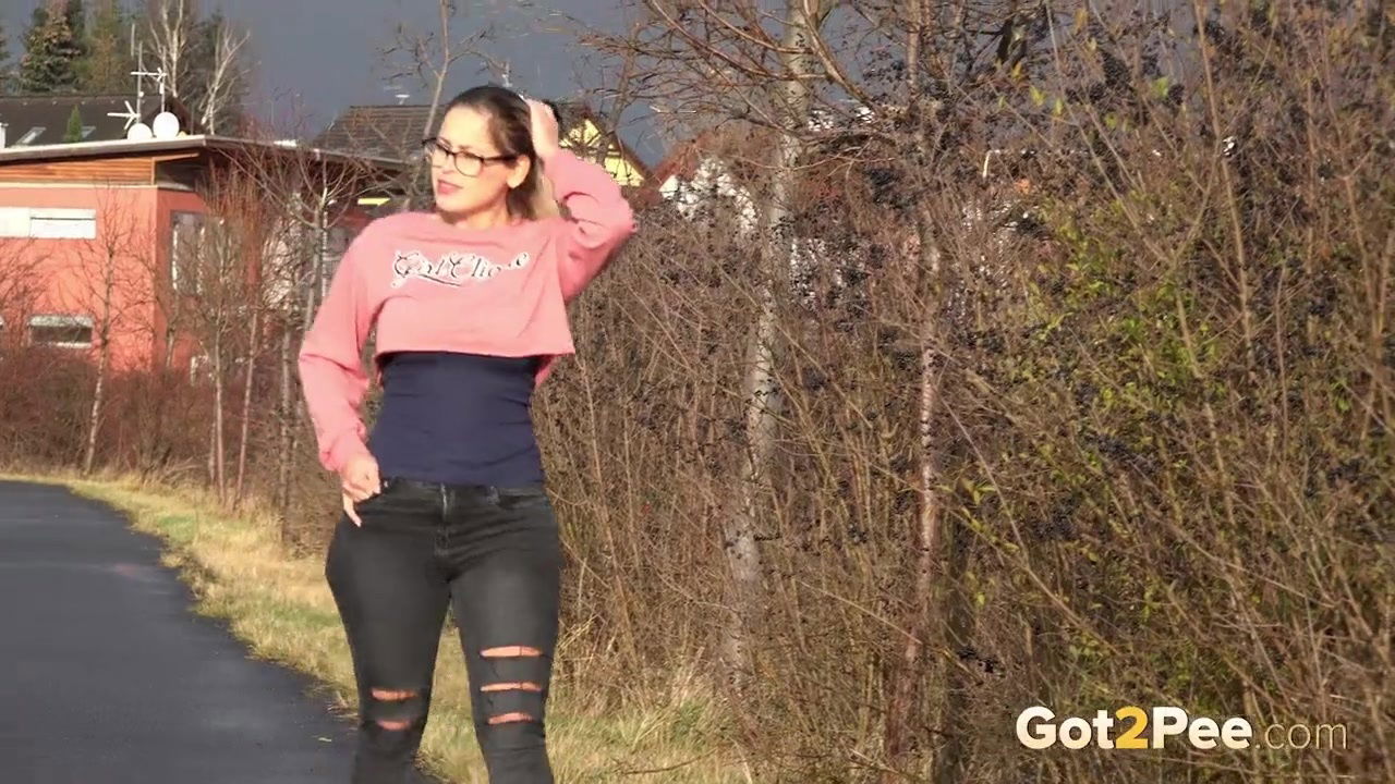 Blonde babe in glasses pisses outside